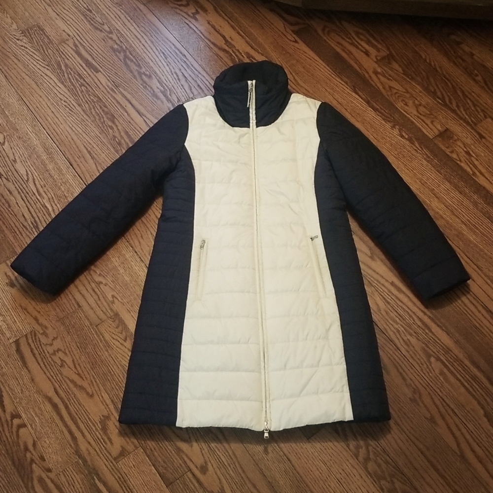 Like new, worn once, knee length winter coat in navy/cream.